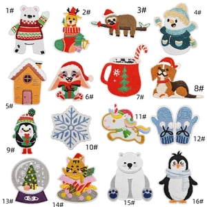 Close-up of 16-piece Christmas embroidery patches featuring reindeer and snowman designs