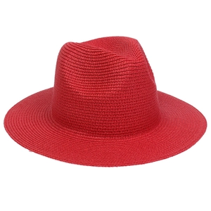 Detailed view of the red straw sun hat showing high-quality woven texture and brim