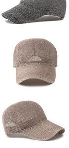Detail of dark grey and champagne gold sequined mesh baseball caps with fine glitter texture