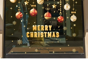 Detail of Merry Christmas static window stickers with golden 3D hanging baubles and snowflakes