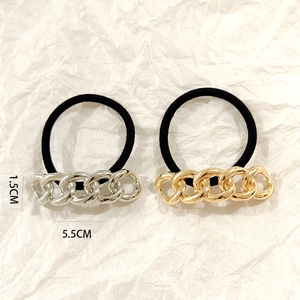 Detail of hollow alloy hair ties in gold and silver finish with 5.5cm chain decoration