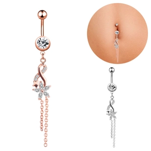 Detailed view of floral belly button rings with zircon tassels in rose gold and silver