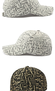 Detailed close-up of textured jacquard baseball cap with adjustable metal back buckle
