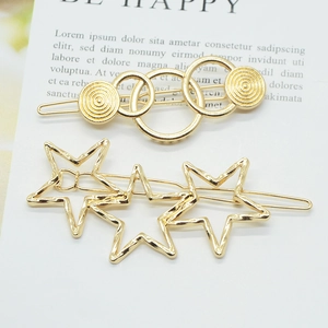 Golden metal hair clips set featuring connected circles and hollow star designs