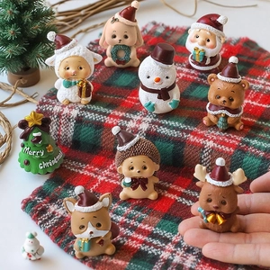 Miniature Christmas resin figurines collection featuring Santa and animals on plaid scarf