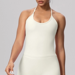 Close-up of ivory halter-neck sports top with premium high-stretch moisture-wicking fabric