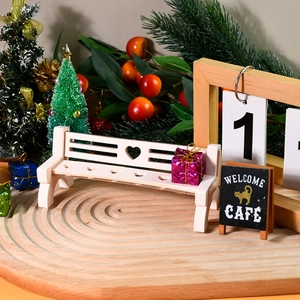Miniature white park bench with heart cutout design for micro landscape and DIY decor