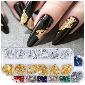Detailed view of 12-color nail art foil flakes in a box and applied on black manicured nails