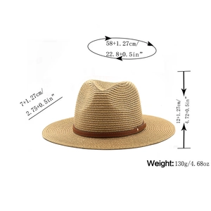 Detailed view of straw Panama hat dimensions with brown leather strap and metal buckle
