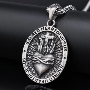 Silver stainless steel Sacred Heart of Jesus oval cross pendant for men shown in macro view