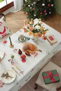 Detailed festive view of waterproof polyester tablecloth with Christmas deer and poinsettia