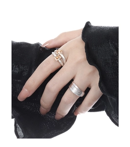 Detail of S925 silver double-layered ring with orange gem and black lace cuff