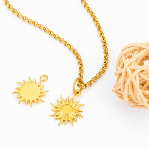 Detailed view of polished golden stainless steel sun pendant with O-chain and woven wood ball