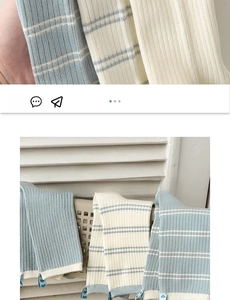Detail of cream and baby blue striped ribbed socks made of premium combed cotton fabric