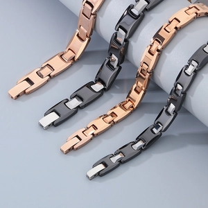Detailed macro view of rose gold and black tungsten steel bracelets with H-shaped link chains