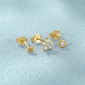 Detailed macro view of S925 sterling silver gold earrings set with zircon stones