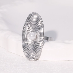 Detail of oval sunburst ripple ring with center pearl and adjustable silver band