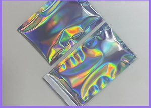 Detailed close-up of two holographic self-sealing bags with vibrant rainbow reflection