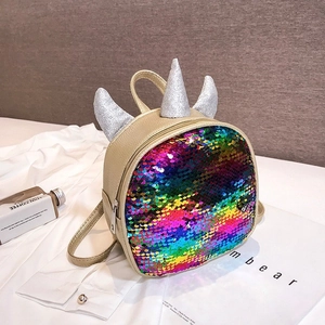 Children colorful sequin mini backpack detail view with cute unicorn horn design features.