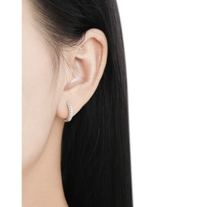 Elegant S925 sterling silver hoop earrings with full pave cubic zirconia on a model
