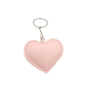Pink heart-shaped leather keychain with fine stitching and silver metal ring accessory
