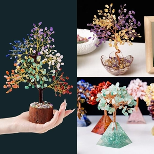 Detail of assorted natural crystal money trees with wire branches and gemstone leaves