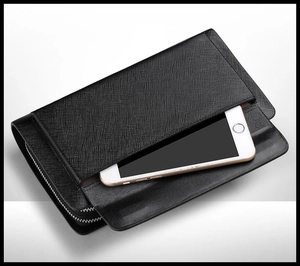 Top view of black crossgrain leather clutch bag with exterior pocket and metal zipper