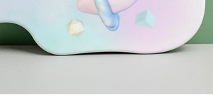 Close-up of the scalloped edge on a portable cute tooth-shaped hand mirror with pastel gradient