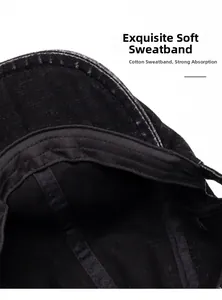 Detailed close-up of cotton sweatband inside black vintage beret with white stitching