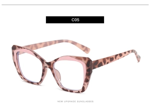 Detail of TR90 square frame glasses with tortoiseshell pattern and pink accents