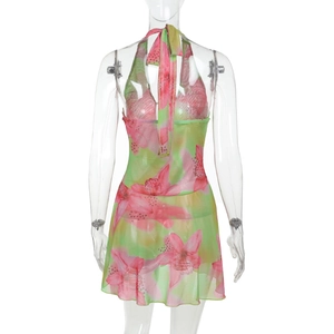 Detail of floral print backless halter dress in pink and green gradient chiffon