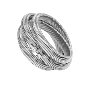 Macro detail of triple-layer tubogas snake-bone bracelet with sparkling zircon inlay