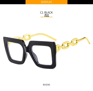 Side view of square black glasses frame featuring chunky gold metal chain link temples