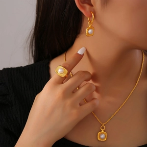 Elegant gold-tone jewelry set with polka dot hammered texture and freshwater pearls
