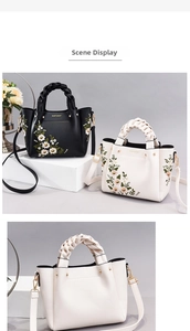 Detail of floral embroidery and woven handles on elegant lady handbag in macro view
