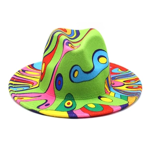 Detailed view of wide-brim felt hat with vibrant pop art graffiti and colorful patterns