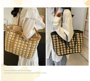 Detail view of woven straw tote bags in beige and black check with leather straps