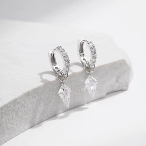S925 sterling silver hoop earrings with kite-shaped crystal pendants on marble stone