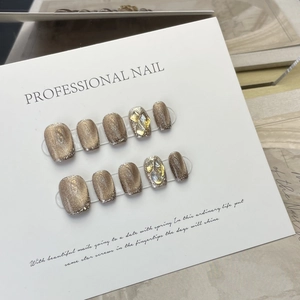 Handmade champagne gold cat-eye press-on nails with sparkling crystals and glitters
