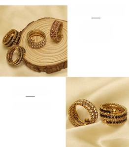 Macro shot of 18k gold plated stainless steel multi-layer rings with colorful zircons