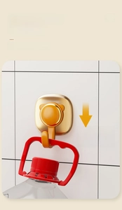 Detail of high-load adhesive wall hook holding a heavy water bottle on white tile