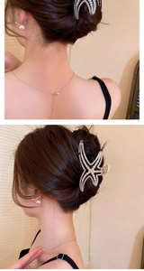 Detail showing elegant starfish hair claw with pearls and rhinestones on hair