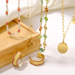 Collection of colorful beaded necklaces with gold star and daisy pendants for a layered look