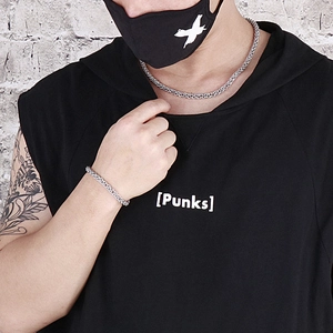 Silver stainless steel lantern link chain necklace and bracelet on a punk style model