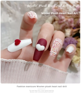 Close-up of winter 3D flocking velvet heart charms and tweed texture nail art on nails