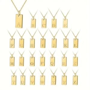 Detailed display of 26 gold-plated square letter pendants on fine link chains
