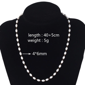 Elegant pearl and gold chain necklace shown on a black velvet mannequin with dimensions
