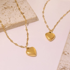 Elegant 18k gold plated stainless steel heart pendant bracelets on decorative stones