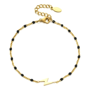 Detail of gold lightning bolt pendant on bohemian bead chain with lobster clasp