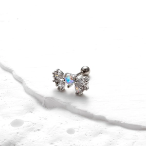 Detailed close-up of a butterfly stud earring with clear zircons and screw back